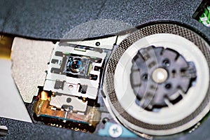 Laser head for cd or dvd player.Close up of a DVD player ejecting disc photo