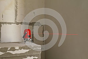Laser level measuring tool in construction site