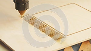 Laser machine cutting wood and plywood