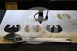 The laser machine produces cutting and engraving of plywood
