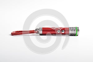 Laser pointer flashlight on white background