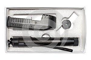 A laser pointer on a white background.A pointer with a green laser.Powerful laser pointer