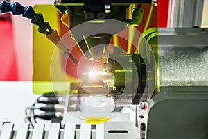 Laser processes the metal part in the laboratory or in production