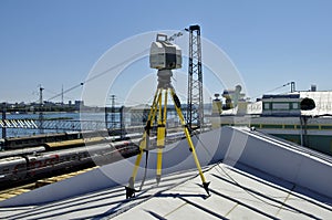 Laser scanner working at roof photo