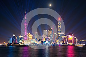 Laser show over Lujiazui skyline and Huangpu river, Shanghai, China