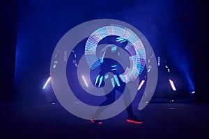 Laser show performance, dancers in led suits with LED lamp, very beautiful night club performance, party