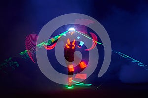 Laser show performance, dancers in led suits with LED lamp, very beautiful night club performance, party