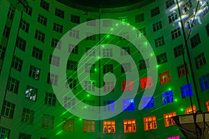 Laser show on the wall of multistory building
