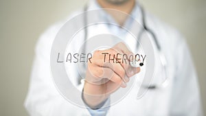 Laser Therapy , Doctor writing on transparent screen