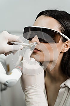 Laser treatment inflammation of the nasal lining, runny nose, sneezing symptoms. Laser treatment of chronic rhinitis