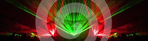 Lasershow festival disco  party background banner panorama - Colorful outdoor laser show with rays streams and crowd silhouette of