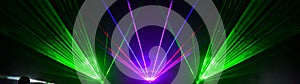 Lasershow festival disco  party background banner panorama - Colorful outdoor laser show with rays streams and crowd silhouette of