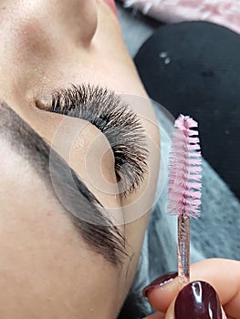 Lash extensions in beauty salon macro eye top view