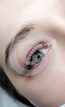 Lash extensions in beauty salon macro eye top view