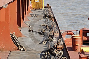 Lashing material, bottom twist-locks and turnbuckles for securing containers on the container vessel to secure containers, photo