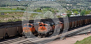 9111 and 9086 lashup and 6271 and 5660 lashup diesel locomotives head eastbound loaded coal trains
