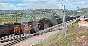 9111 and 9086 lashup and 6271 and 5660 lashup diesel locomotives head eastbound loaded coal trains