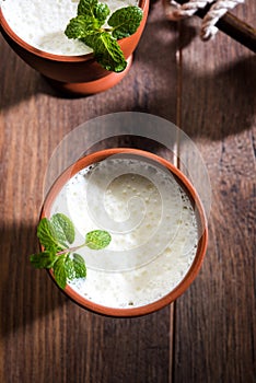 Lassie or lassi drink in terracotta glass