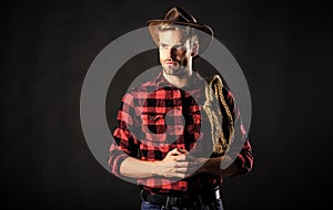 Lasso used rodeos competitive events. Man wearing hat hold rope. Lasso tool of American cowboy. Lasso can be tied or