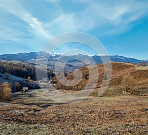 Last good weather days in autumn mountain countryside morning peaceful picturesque scene. Ukrainian Carpathians mountains in far