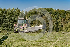 Last mowing of a tractor in a meadow