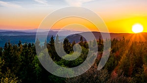 The last rays of the sun from the iron lookout tower in the Owl Mountains