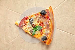 Last slice of tasty pizza with olives and sausages