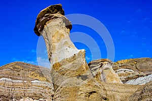 Last snow of the year clings to Hoodoos. Drumheller,Alberta,Canada