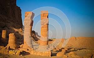 Last standing pillars of Napata`s temple of Amun at the foot of Jebel Barkal mountain at Karima, Sudan