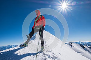 Last steps before Mont Blanc Monte Bianco summit 4,808m of smiling rope team man with climbing axe dressed mountaineering