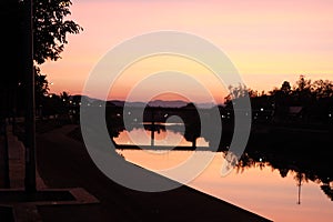 The Last Twilight of the Year over Nan River Bridge at Nan Province Thailand on 31 December 2022