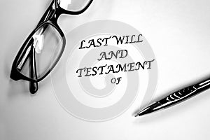 Last Will and Testament Glasses and Pen on Desk for Signing