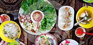 Lat lay or Top view of Vietnamese food with grilled pork sausage, many fresh vegetable