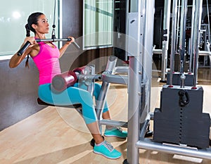 Lat pulldown machine woman workout at gym