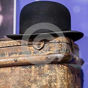 late 19th century bowler hat on an old suitcase from the same era