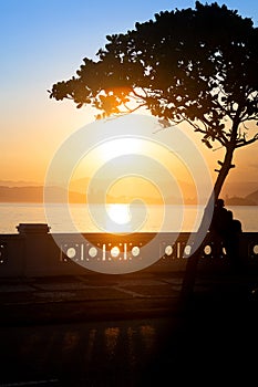 Late afternoon at Ponta da Praia, in Santos, Brazil, Sunset at Ponta da Praia, in Santos, Brazil, with the silhouette of an couple