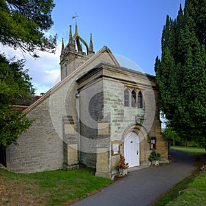 Late afternoon summer light on All Hallow's Church at Tillington next to the Petworth Estate in the South Downs National Park,