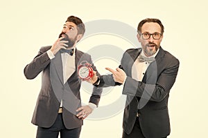 Late again. angry businessmen. bad morning. a lot of work. time management. mature bearded men in formal suit hold alarm