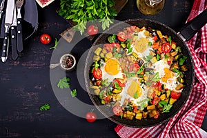 Late breakfast - fried eggs with vegetables. Shakshuka.