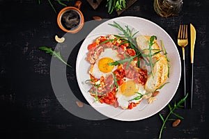 Late breakfast - fried eggs with vegetables. Shakshuka.