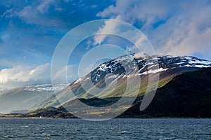 Late day sun shines on mountains surrounding Beaver Channel in Argentina