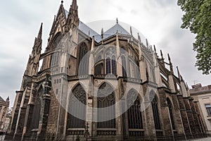 late-gothic cathedral with flying buttresses, stained glass windows, and detailed stone carvings