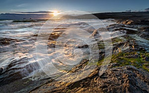 Late light catching surf over rocks, Constantine Bay, Cornwall