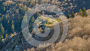 First snow on rocky hills of Montseny mountain forests photo