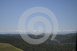 Late Spring in Montana: View of Snow-Capped Beartooth Mountains Along Highway Southwest of Billings photo
