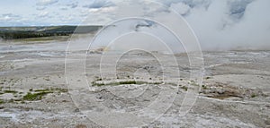 Late Spring in Yellowstone National Park: Clepsydra Geyser Erupts With Quiet Spasm Geyser in Foreground in the Fountain Group of L