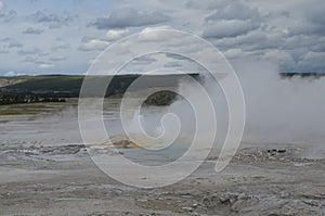 Late Spring in Yellowstone National Park: Clepsydra Geyser of the Fountain Group Spouts in Lower Geyser Basin