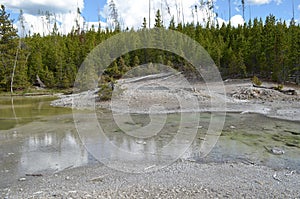 Late Spring in Yellowstone National Park: Dishwater Spring Atop a Geyserite Mound in the Back Basin Area of Norris Geyser Basin