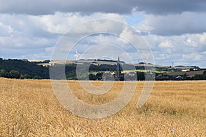 late summer Eifel with the church tower of Welling