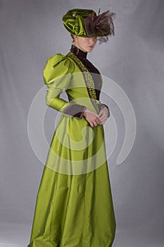 Late Victorian woman in green silk ensemble photo